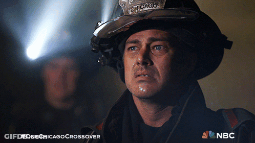 Man In Chicago Helmet Looking At Something GIF