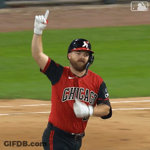 Man In Chicago Jersey Holding Up Glove GIF