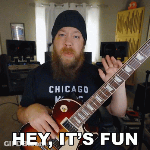 Man In Chicago Shirt Playing Guitar GIF
