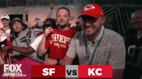 Man In Chiefs Shirt Surrounded By Fans GIF