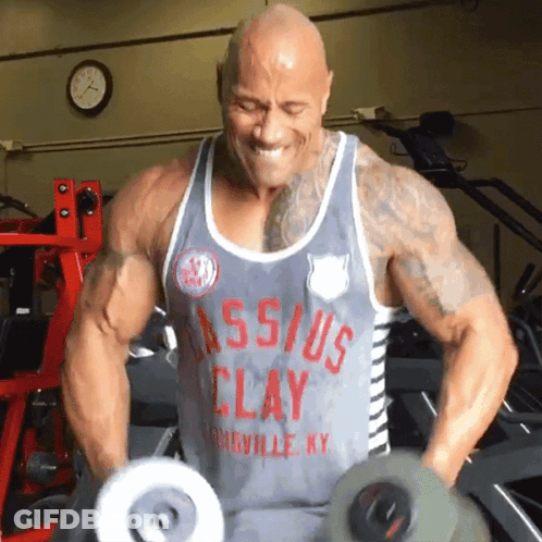 Man In Clay Tank Top Lifting Dumbbells GIF