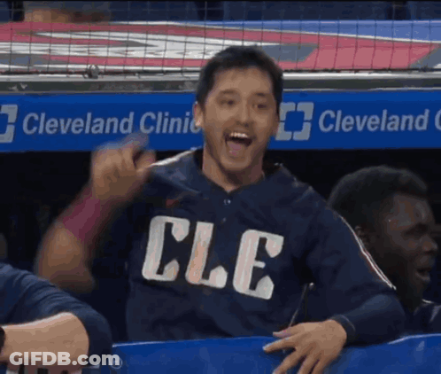 Man In Cle Shirt Sitting In Dugout GIF