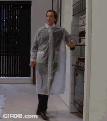 Man In Clear Raincoat Walking GIF
