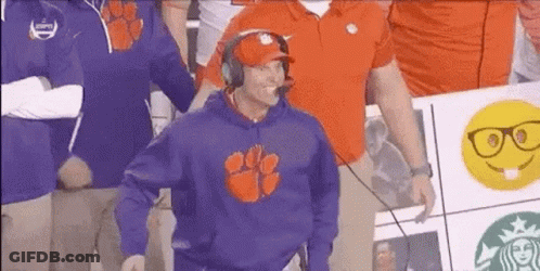 Man In Clemson Sweatshirt And Headphones In Front Of Crowd GIF