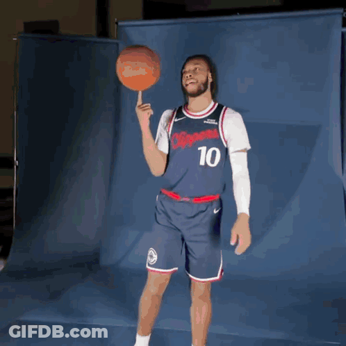 Man In Clippers Jersey Holding Basketball On Finger GIF
