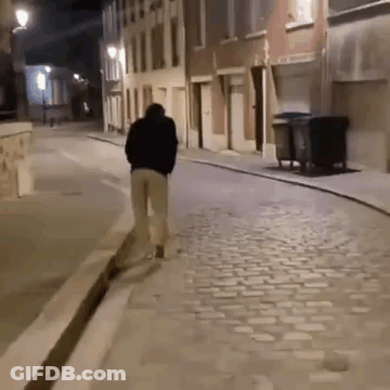 Man In Clown Costume Holding Cup GIF
