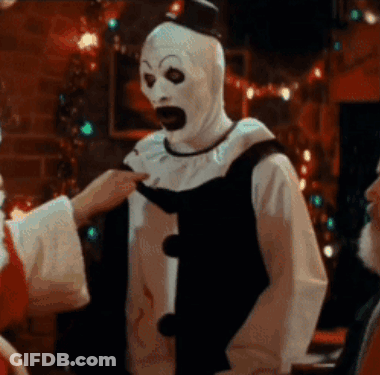 Man In Clown Costume Touched By Santa GIF
