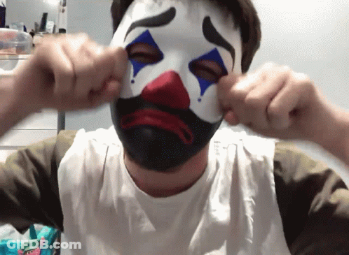 Man In Clown Mask Covering Face GIF
