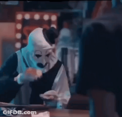 Man In Clown Mask Eating Food GIF