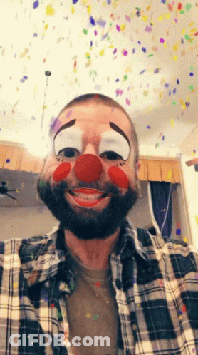 Man In Clown Mask With Confetti Falling GIF