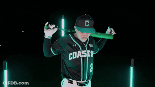 Man In Coast Baseball Uniform Holding Bat GIF