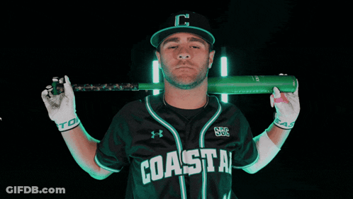 Man In Coastal Jersey Holding Bat Over Shoulder GIF