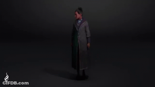 Man In Coat And Tie Holding Wand In Dark Room GIF