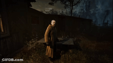 Man In Coat In Front Of Building GIF