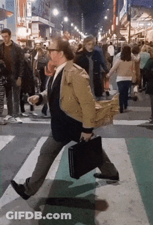Man In Coat Walking Freeze GIF