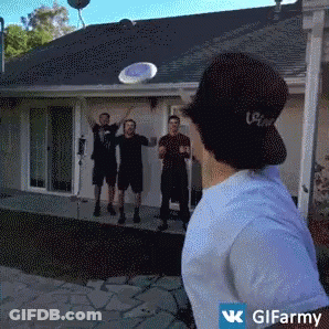 Man In Coca Cola Hat Throws Frisbee GIF