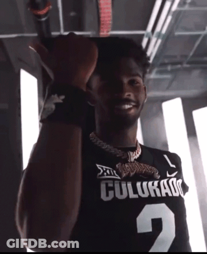 Man In Colorado Jersey Holding Microphone GIF
