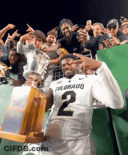 Man In Colorado Jersey Holding Trophy GIF