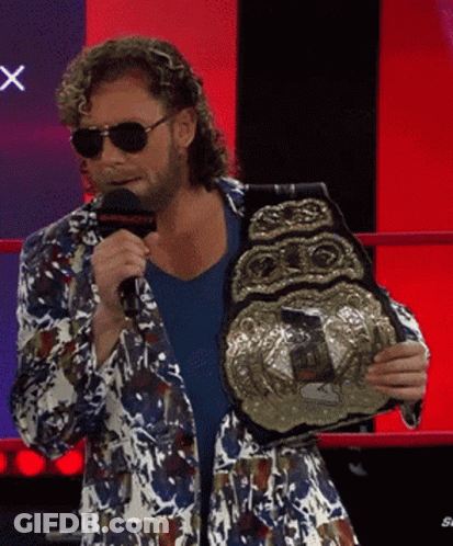Man In Colorful Jacket Holding Wrestling Championship Belt GIF