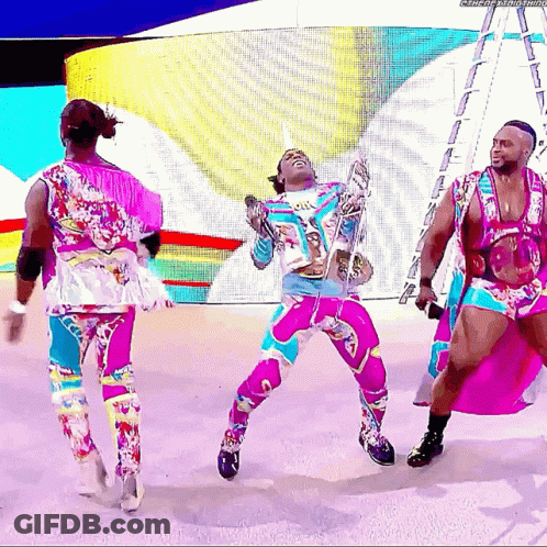 Man In Colorful Outfit Dancing With Microphone GIF