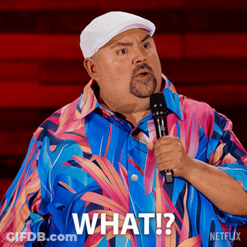 Man In Colorful Shirt Holding Microphone Saying What GIF
