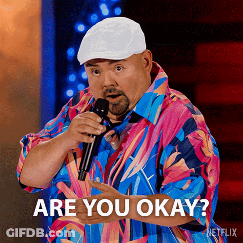 Man In Colorful Shirt Holding Microphone Says Are You Okay GIF