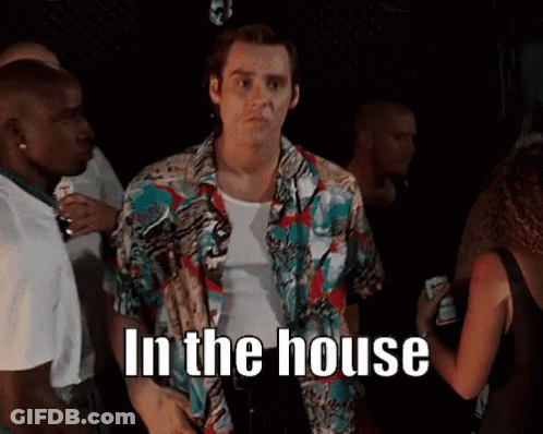 Man In Colorful Shirt In Crowd Saying In The House GIF