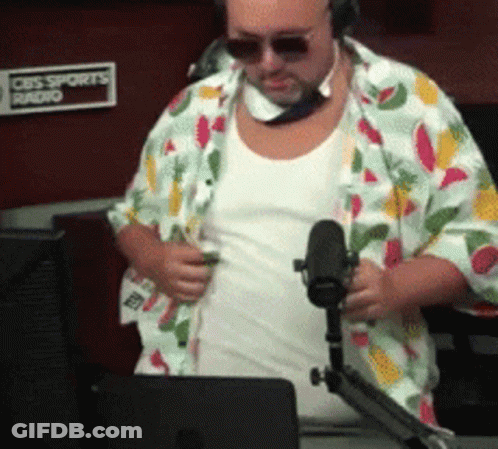 Man In Colorful Shirt In Front Of CBS Sports Radio Sign GIF