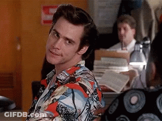 Man In Colorful Shirt In Front Of Fire Extinguisher GIF