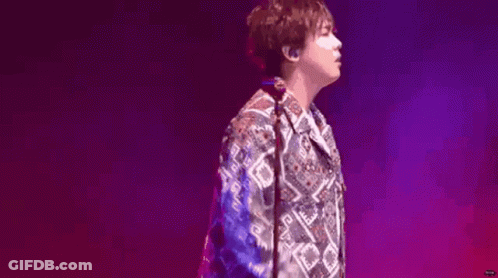 Man In Colorful Shirt On Stage GIF