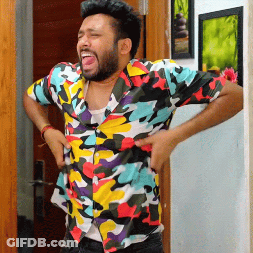 Man In Colorful Shirt Standing Hands On Hips GIF