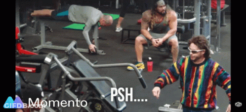 Man In Colorful Sweater In Front Of Gym Machine Saying Momento GIF