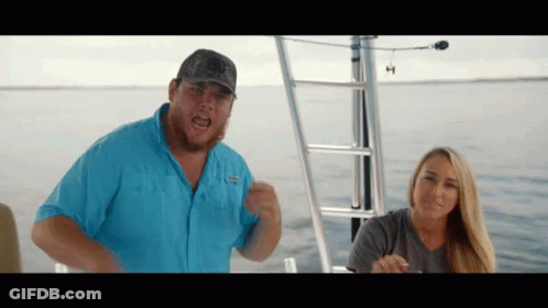 Man In Columbia Blue Shirt On Boat GIF