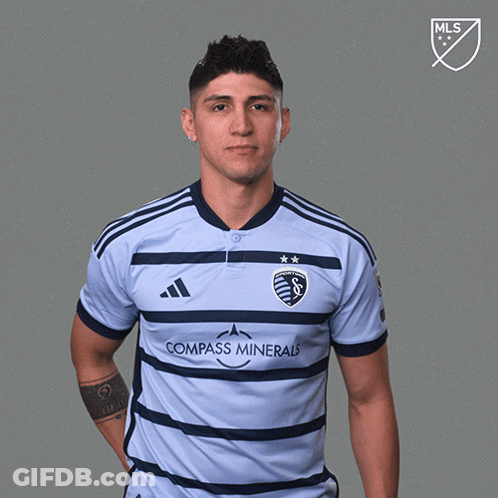 Man In Compass Minerals Jersey Holding Red Card GIF