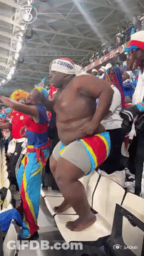 Man In Congo Headband Dancing In Crowd GIF
