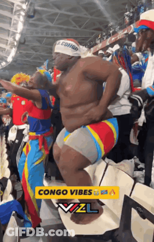 Man In Congo Headband Dancing In Crowd GIF
