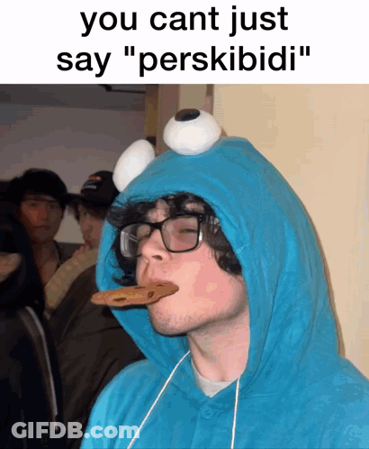 Man In Cookie Monster Costume Eating Cookie GIF