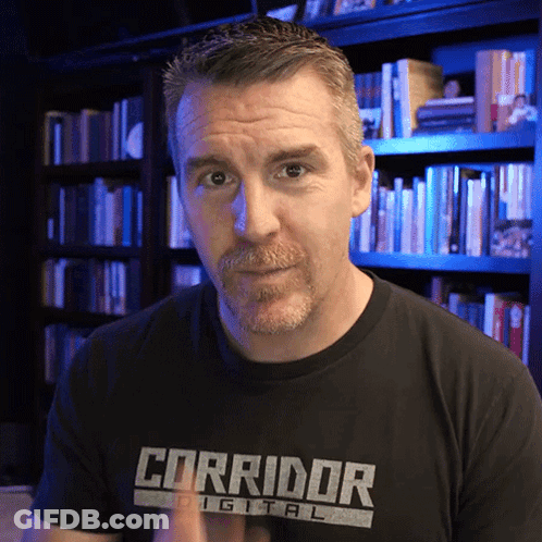 Man In Corridor Digital T-Shirt In Front Of Bookshelf GIF