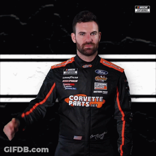 Man In Corvette Parts Uniform Black And White GIF