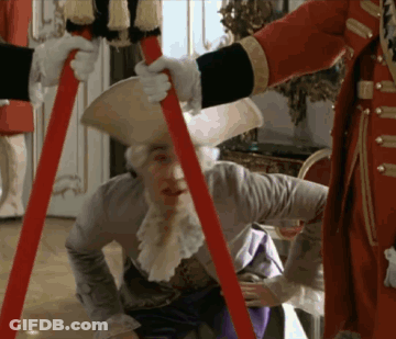 Man In Costume Held Up By Another Man GIF