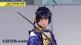 Man In Costume Holding Sword GIF