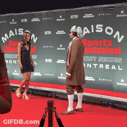 Man In Costume On Red Carpet At Maison Sports Illustrated GIF