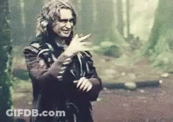 Man In Costume Pointing In Woods GIF
