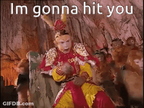 Man In Costume Sitting With Monkeys Saying Im Gonna Hit You GIF