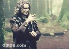 Man In Costume Smiling In Woods GIF