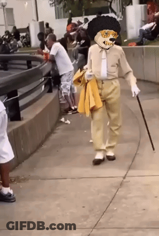 Man In Costume With Cane Walking GIF