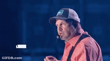 Man In Cowboy Hat And 3D Glasses Looking GIF