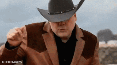 Man In Cowboy Hat And Brown Jacket Pointing GIF