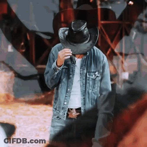 Man In Cowboy Hat And Denim Jacket GIF