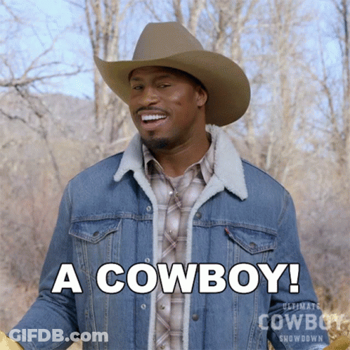 Man In Cowboy Hat And Denim Jacket Says A Cowboy GIF